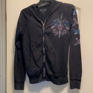 Color is black distressed. Zip up with hood